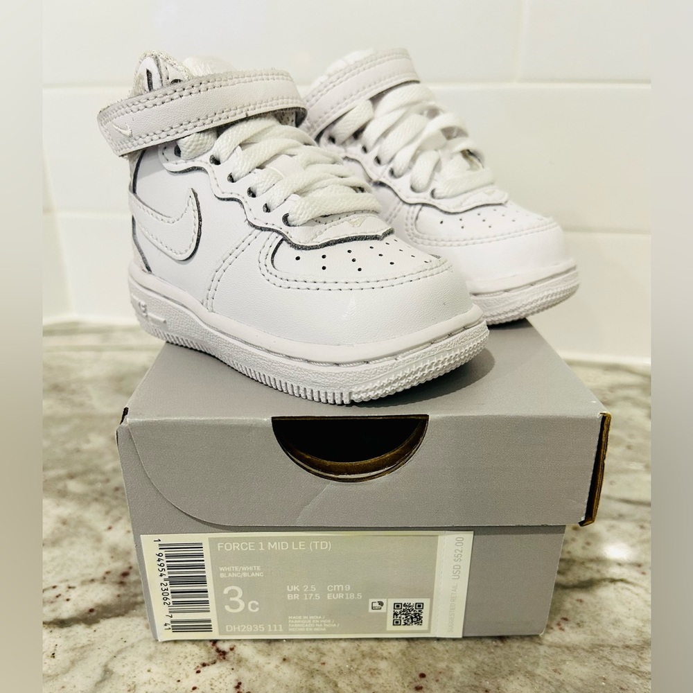 Baby boys white Nike shoes